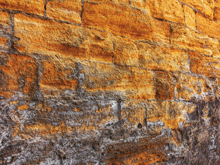 Wall built of natural stone, perspective. Can be used as background. Great background or texture.