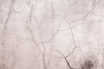 Abstract creative background of chaotic strokes of old cracked paint on concrete wall. Old surface with traces of paint, weathered, scratches and cracks for design
