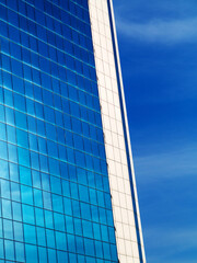 Obraz premium Bottom view of modern high rise building in the port of Odessa in the sunset at the end of the day
