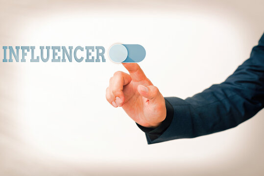Writing note showing Influencer. Business concept for the an individual who inspires or guides the actions of others Model with pointing hand finger symbolizing navigation progress growth
