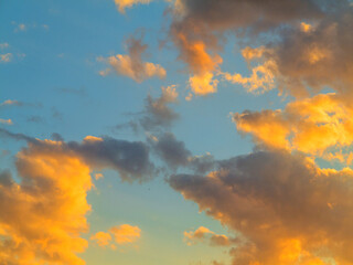 Beautiful background of clouds and sky at sunset at the end of the day