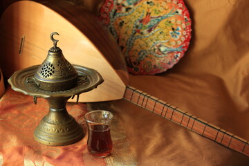 Turkish national musical instrument baglama saz, incense burner in the Ottoman Muslim style and a traditional handmade plate