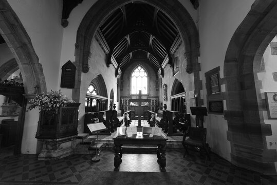 Inside of an English church in summertime.