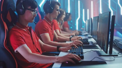 Diverse Esport Team of Pro Gamers Play in Mock-up FPS Shooter Video Game on a Championship. Stylish Neon Cyber Games Arena. Online Broadcasting of Tournament Event. Side View Dolly