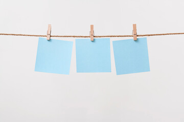 paper cards hanging rope isolated on white background
