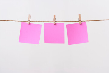 paper cards hanging rope isolated on white background
