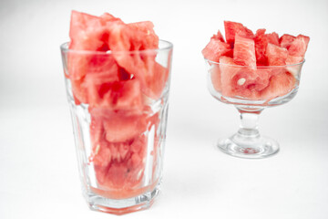 watermelon chopped pieces in a glass cup, summer fruit refreshment