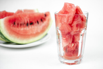 watermelon chopped pieces in a glass cup, summer fruit refreshment