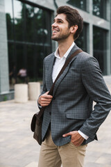 Business man outdoors near business center