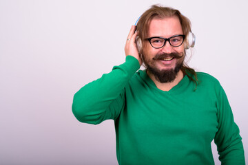 Portrait of happy bearded man with mustache and long hair