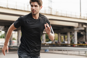 Image of athletic sportsman running while working out