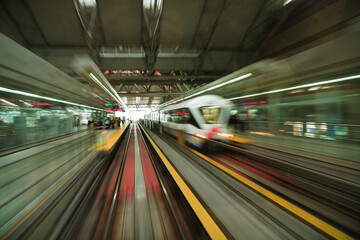Abstract motion blur photo of subway road, monorail, train station