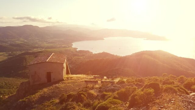 Panoramic sunset of Portoferraio Gulf, Elba Island, from mount Volterraio on which the fortress dominates north part of island of Tuscany Archipelago, Italy. Church of San Leonardo on background.