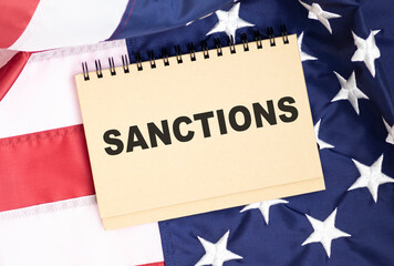 Fototapeta na wymiar text Sanctions on a background with American flag.Waved highly detailed fabric texture.