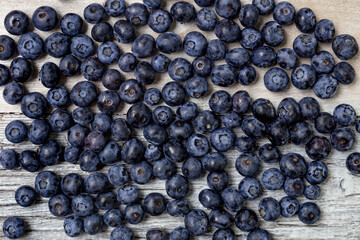 Blueberries on a white wooden background. Concept for healthy eating. Antioxidant organic superfood.