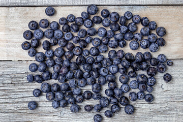 Blueberries on a white wooden background. Concept for healthy eating. Antioxidant organic superfood.