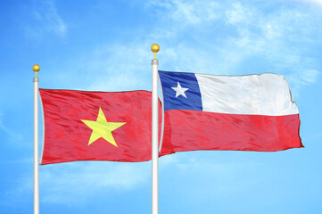 Naklejka na ściany i meble Vietnam and Chile two flags on flagpoles and blue sky