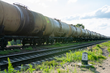 Fototapeta na wymiar Old barrels of oil on the railway.