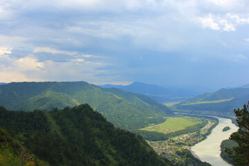 Naklejka premium view from a high mountain to the river and the sky in Gorny Altai