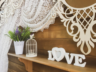 Photozone "Love" with a bird outside the cage and a vase of flowers