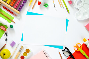 Colorful school background with blank sheet of paper. Back to school. Flat lay.