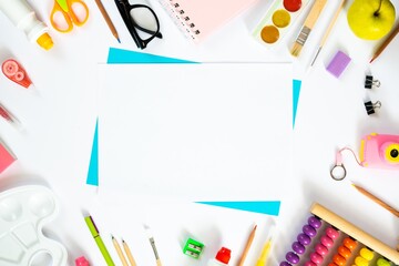 Colorful school background with blank sheet of paper. Back to school. Flat lay.