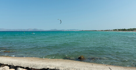 Sunset in La Bahía de Alcudia. In front of the Colònia de Sant Pere, on the right the town of Can...