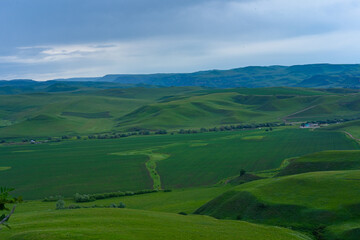 Fototapeta premium Mountains and plains stretching over the horizon