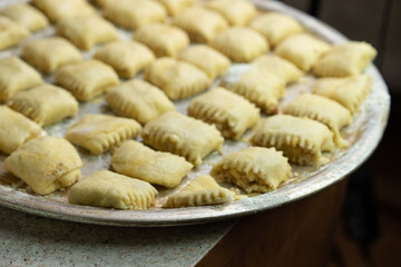 Sweet pastries made from dough are on a tray