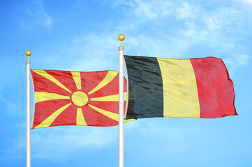 North Macedonia and Belgium two flags on flagpoles and blue sky