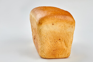 Loaf of bread on white background. Square long loaf of bread. Space for text.