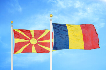 North Macedonia and Chad two flags on flagpoles and blue sky