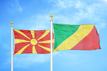 North Macedonia and Congo two flags on flagpoles and blue sky