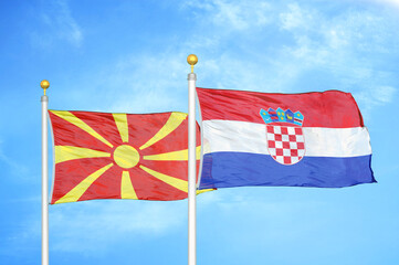 North Macedonia and Croatia two flags on flagpoles and blue sky