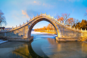 Xiuyi bridge, stands at the largest estuary of Kunming Lake and links the lake with Chang River, feed the flow to the lake and and moats of the Summer Palace