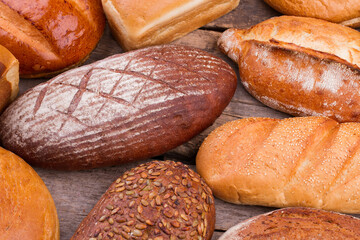 Organic farmers bread on wooden background. Natural bakery products.