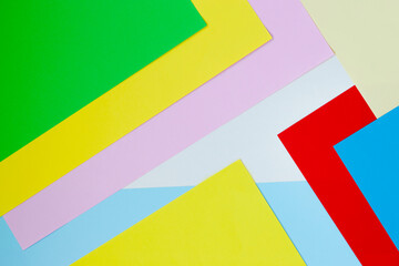 Colored paper of different colors. Chancery. Abstraction from colored paper. Items for art and development. Origami. Set of colored paper.