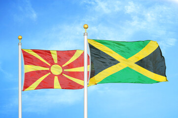 North Macedonia and Jamaica two flags on flagpoles and blue sky