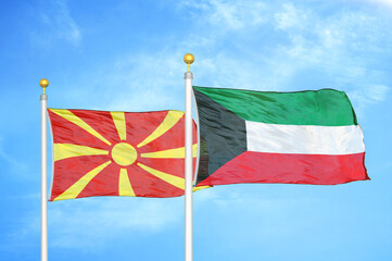 North Macedonia and Kuwait two flags on flagpoles and blue sky