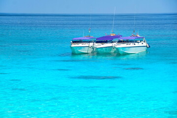Boats for transporting tourists in the sea.Summer sea travel.Summer beach travel.