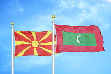 North Macedonia and Maldives two flags on flagpoles and blue sky