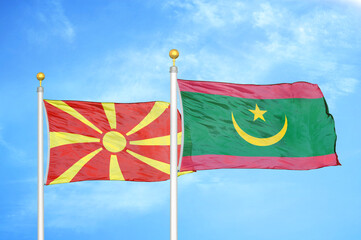 North Macedonia and Mauritania two flags on flagpoles and blue sky