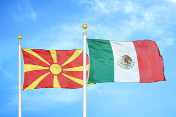 North Macedonia and Mexico two flags on flagpoles and blue sky