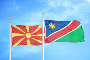 North Macedonia and Namibia two flags on flagpoles and blue sky
