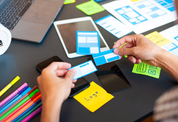 Programmers design application layouts to meet user needs.