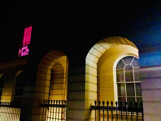 night view of a building in pink