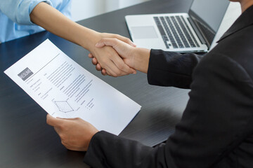 The business owner or the company owner shook hands with the applicant to agree to work in his company. Job search ideas