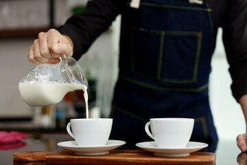 coffee maker pours milk mixed with hot coffee