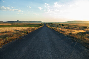 asphalt road and field