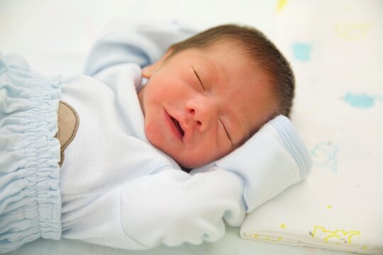 Cute baby asian boy sleeping.